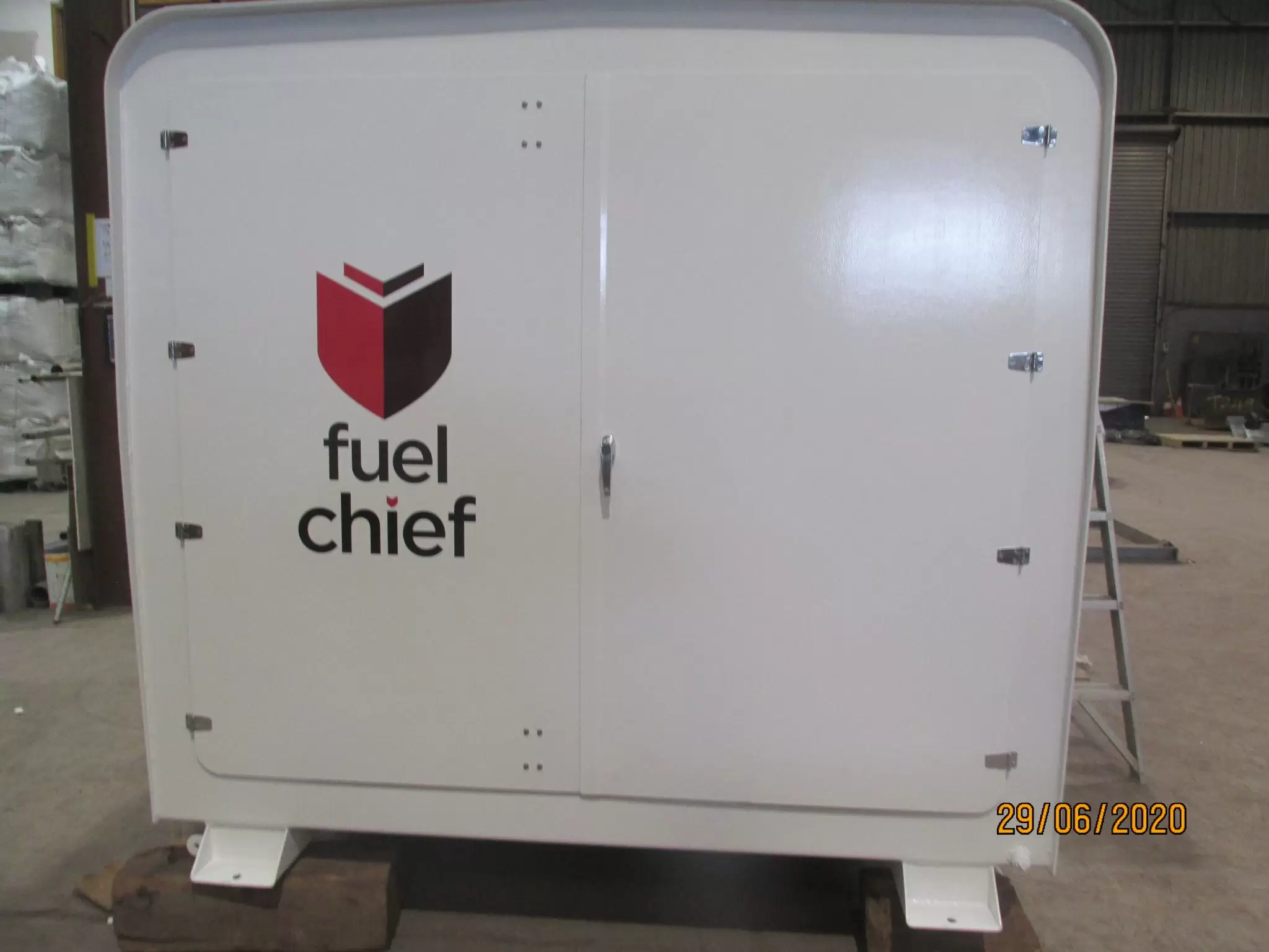 White Fuelchief generator enclosure in a workshop