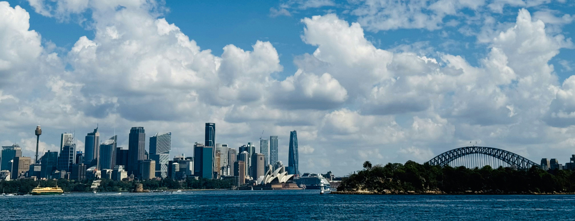 Sydney city skyline and Harbour Bridge across the water