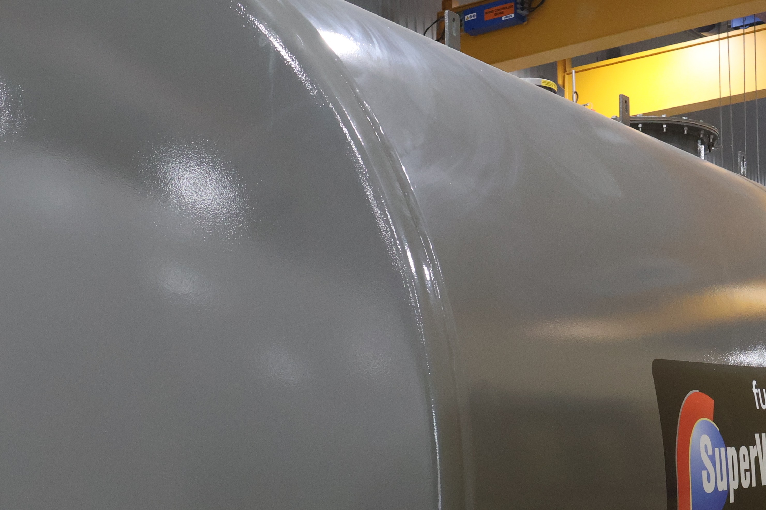 Close view of a grey tank with a SuperVault label