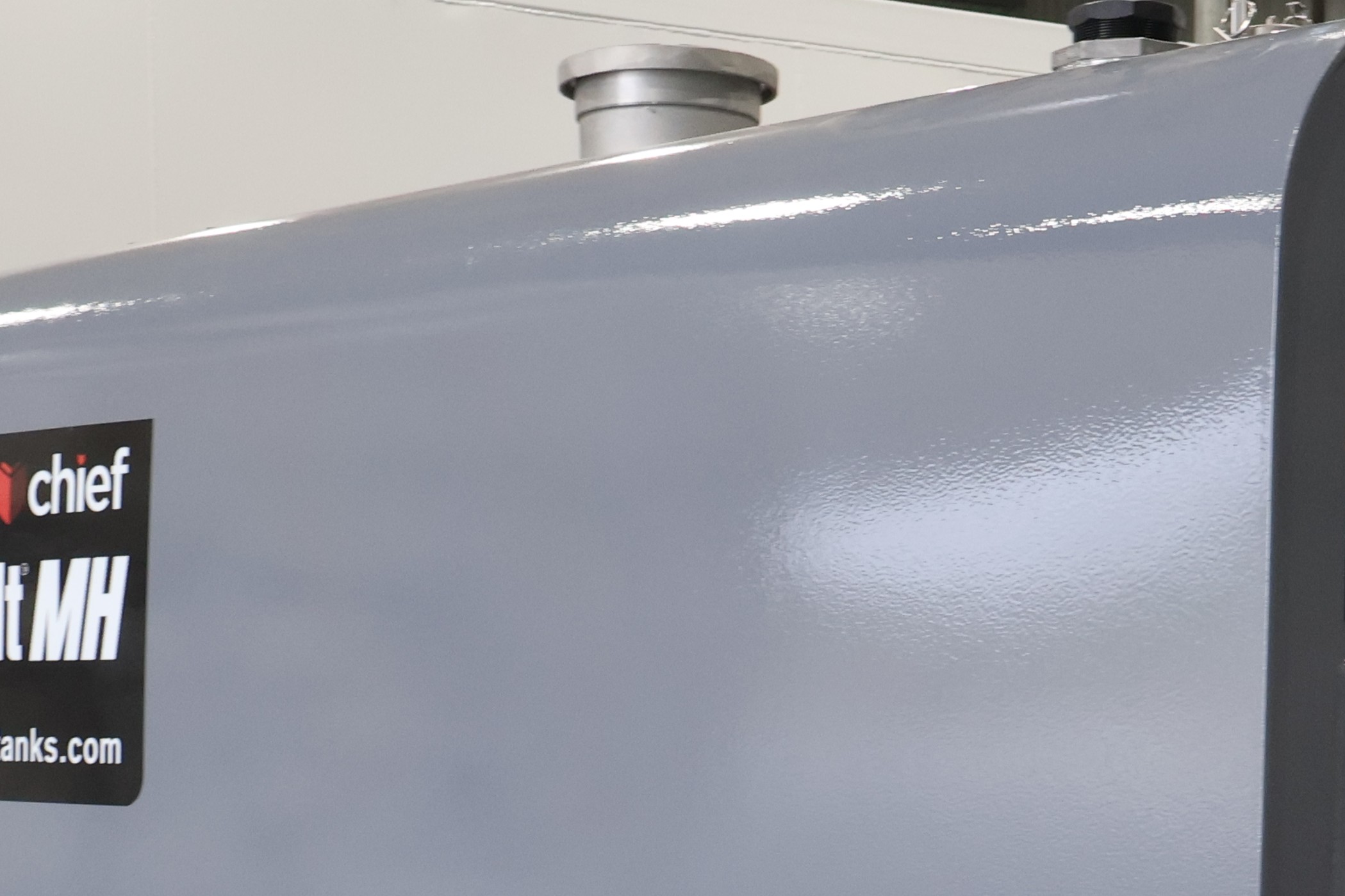 Close view of a grey tank with a Fuelchief label