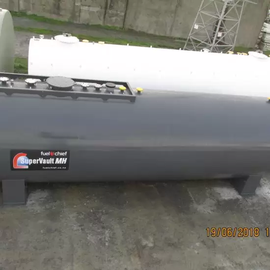 Grey and white tank with a SuperVault MH label in a yard