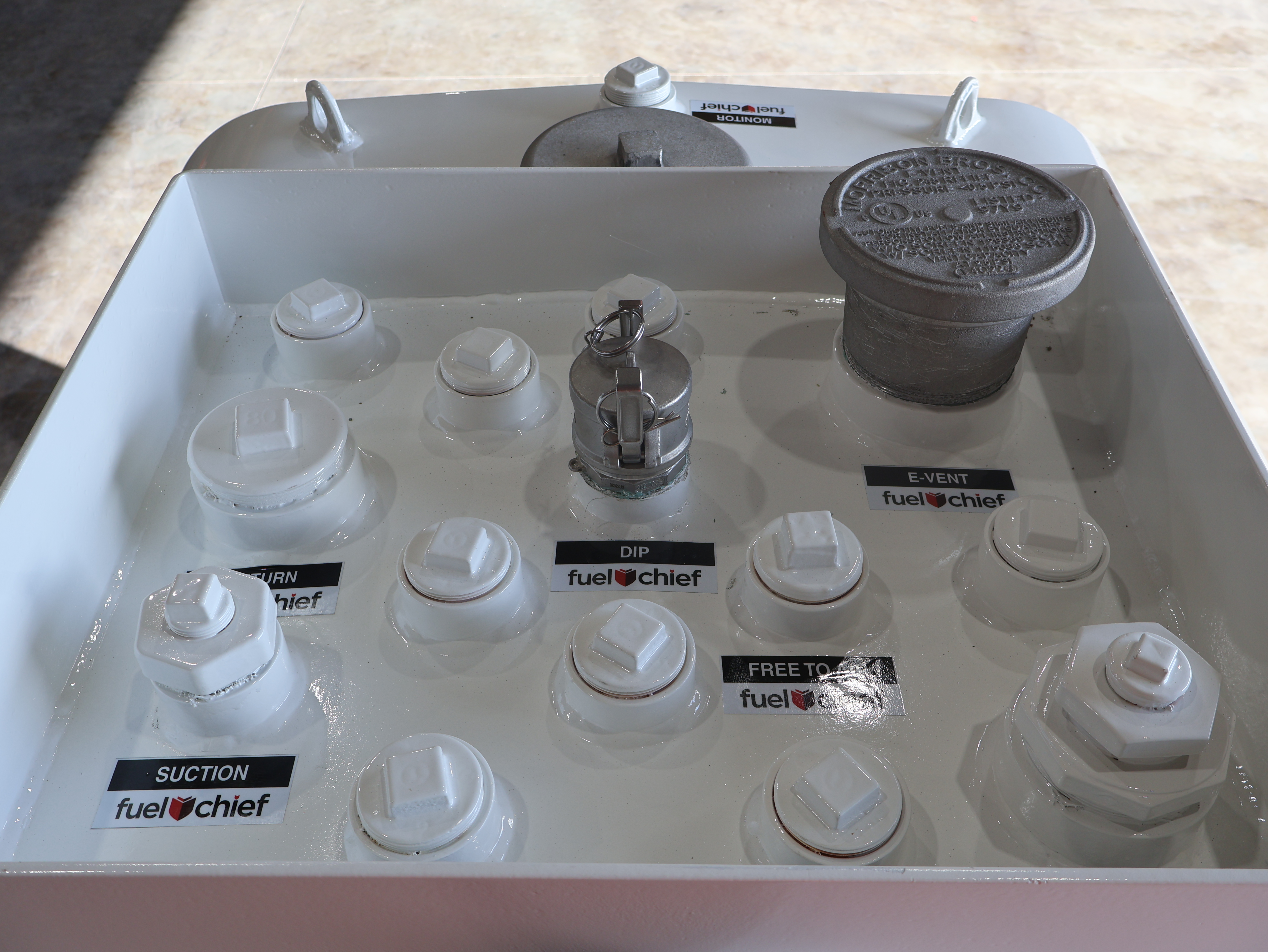 Top of a tank showing its labelled fittings and fill points